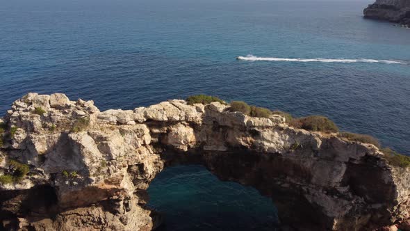 Es Pontas Arch in Cala Santanyi in Mallorca or Majorca, Balearic Islands Spain alt