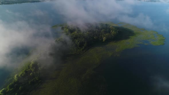 Flight in the Clouds Over the Island of Lake Svityaz alt