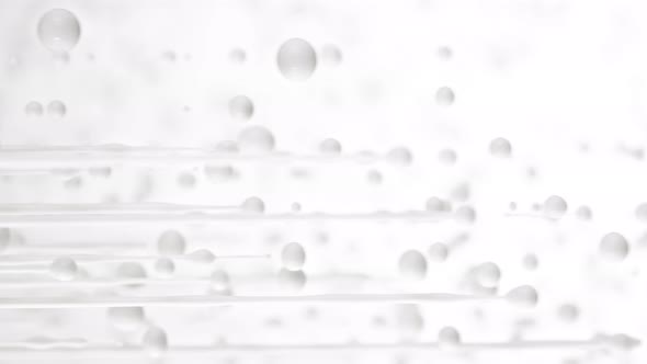 Super Slow Motion Shot of Dripping Milk on White Background at 1000 Fps alt
