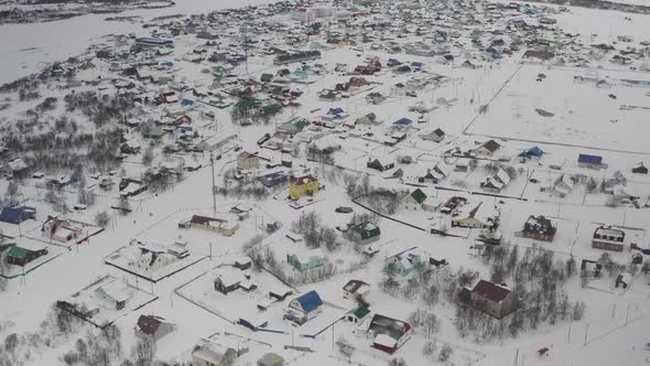 Establishing Shot on a Village Covered with Snow in the Russian Arctic