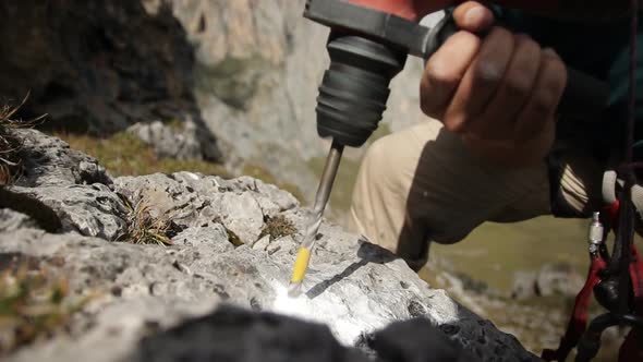 Close-up of the Hammer Drill a Hole in the Rock