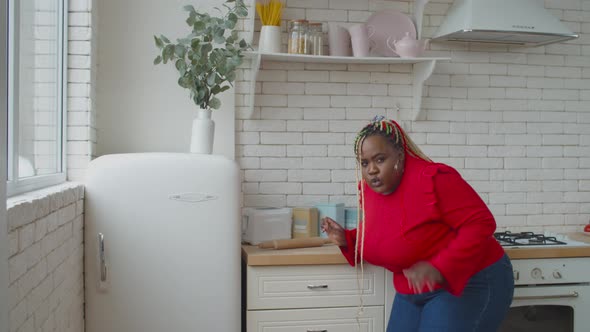 Overweight African Female Caught Near Refrigerator alt