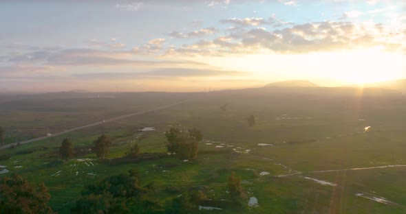 Aerial view of a misty landscape at sunrise, Golan Heights, Israel. alt