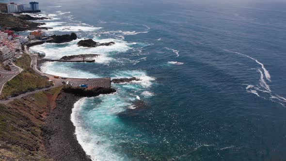 Aerial. Top View Waves Break on the Coastline of Tenerife Island