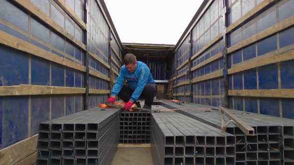 The Man Secures The Load alt