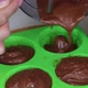 A Woman Pours A Banana Chocolate Smoothie Into A Silicone Mold. From The Blender. Shot Close Up