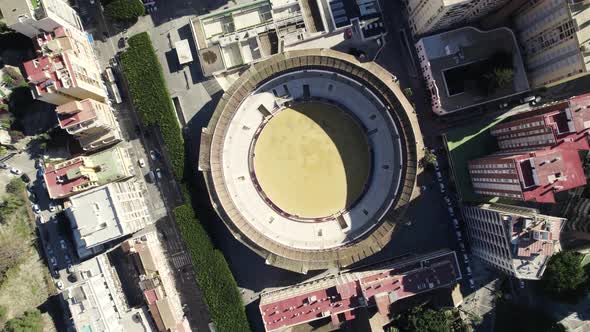 Plaza de toros la Malagueta at Malaga in Spain. Aerial top-down directly above orbiting