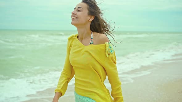 Portrait Happy Expression Woman with Blowing Hair Wearing Yellow Shirt Having Fun on Beach and alt