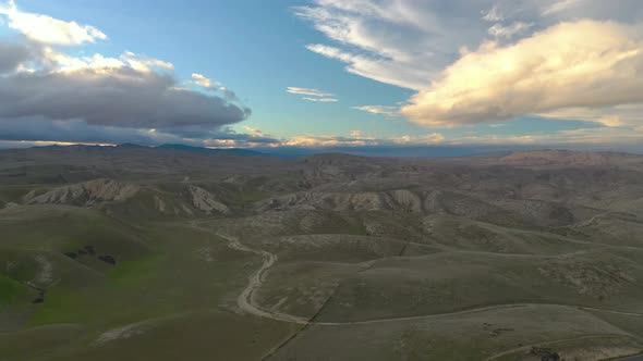 4K UHD Aerial drone view beautiful sky before sunset over mountains alt