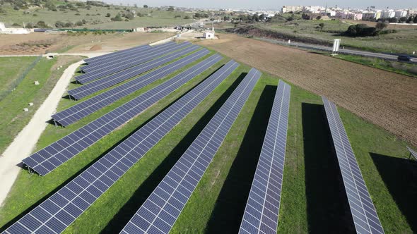 Energy farm concept, rows of solar panels on countryside field, Lagos. Algarve