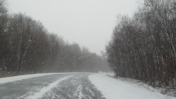 View From Car To Heavy Snowfall on Road in Russia Slow Motion Video