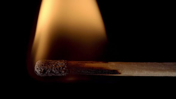 Match burning and burning out. Slow motion