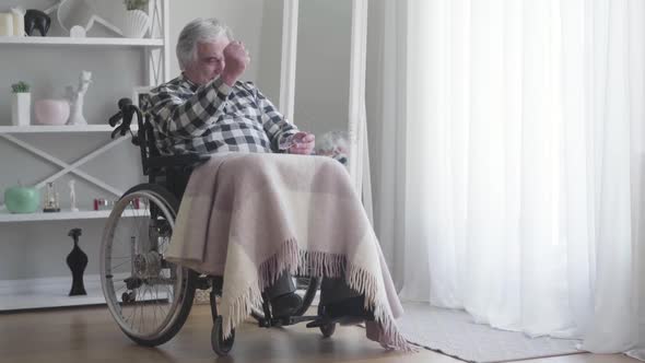 Long Shot, Nervous Old Caucasian Disabled Man Beating Fist on Painful Knee, Mature Ill Retiree alt