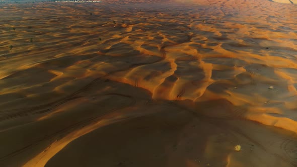 Aerial view of dunes creating shadows at a desert landscape, U.A.E. alt