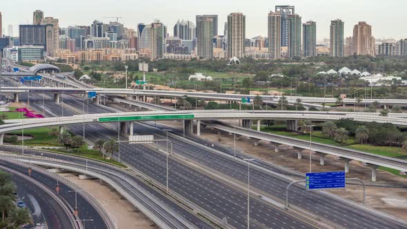 Dubai Golf Course with a Cityscape of Gereens and Tecom Districts at the Background Aerial Timelapse alt