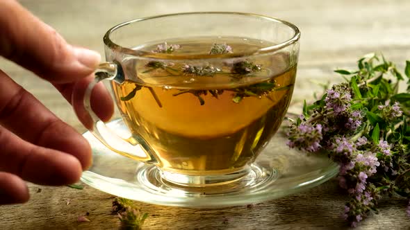 Tea with Thyme in a Transparent Cup alt
