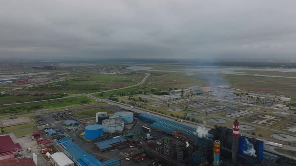 Aerial Panoramic View of Industrial Sites in Flat Landscape alt