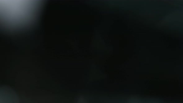 Super Slow Motion Shot of Diamond Light Reflection Isolated on Black Background at 1000Fps alt