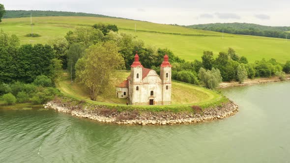 View of the historic church at the Velka Domasa dam in Slovakia alt