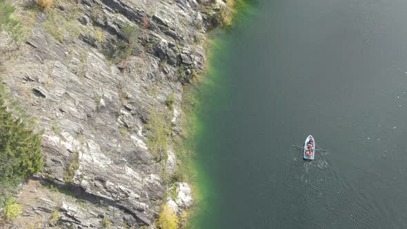 the Boat Floats Along the Cliff in the Ruskeala Mountain Park in Karelia