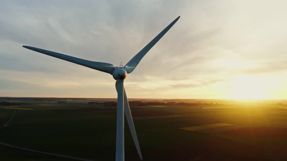 Horizontal Panning From a Drone View of a Wind Farm Among Fields alt