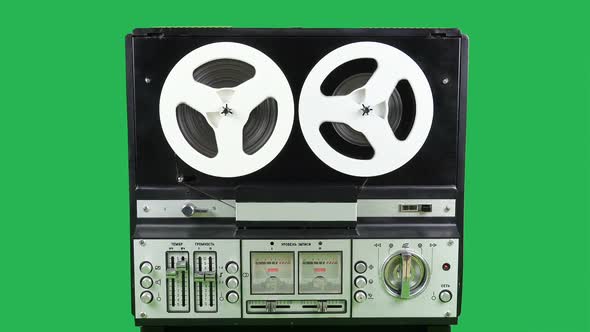 Reproduction Of The Old Bobbin Tape Recorder On The Green Background Of The Ussr Times.