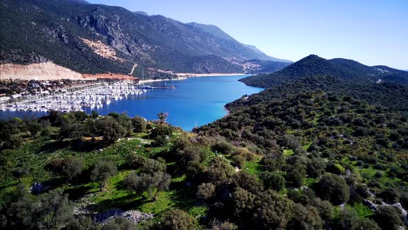 The top view from the drone of Kas resorts, bay with yahts and city in Mugla province of Turkey alt