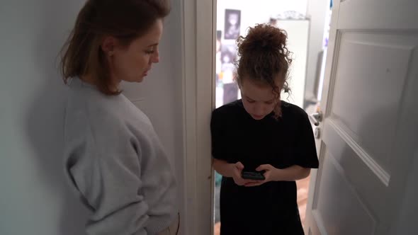 Mother Knocks on the Door of the Daughters Room alt