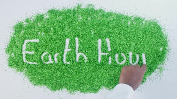 Green Hand Writing Earth Hour