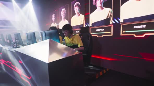 Nervous Teenager Starting to Play Video Game During Competition alt