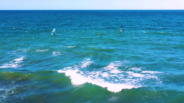 Aerial view of people on windsurf board, Queensland, Australia. alt