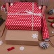 Woman packing Christmas gifts in red paper - VideoHive Item for Sale