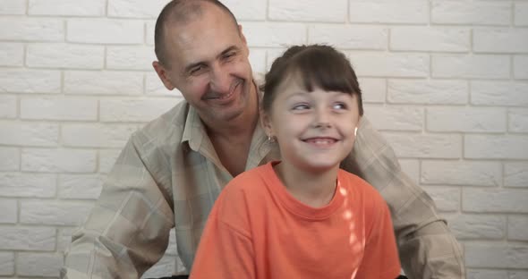 Active family on chairs.  alt