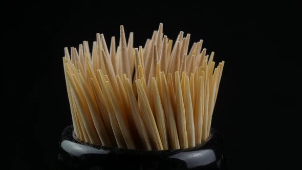 Close up of a group of wooden toothpicks alt