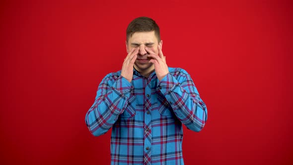 The Young Man Has a Sore Nose He Touches It with His Hand alt