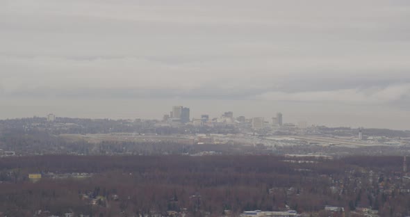 Helicopter aerial of California freeway leading up to Morongo Casino, night alt
