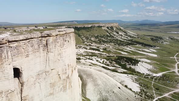 White Chalk Limestone Rock Against a Blue Sky Aerial View alt