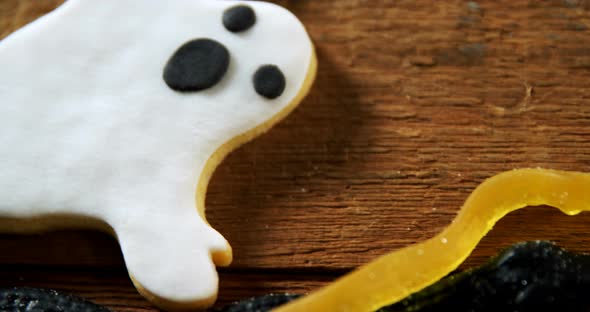 Gingerbread cookie and other sweet foods on a wooden table 4k alt