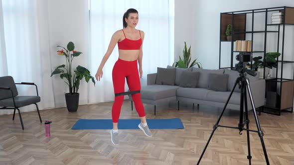Sport Muscular Woman Records Online Course Lesson on Camera Workout at Home alt
