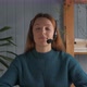 Young Woman in Headset with Microphone Holding Online Meeting - VideoHive Item for Sale