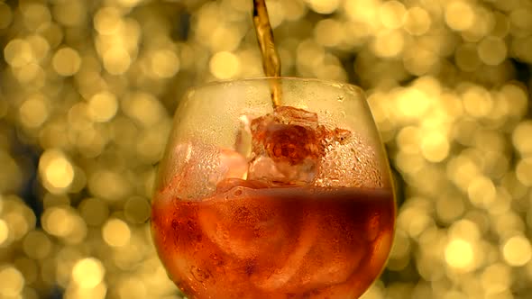 Cocktail is Poured to the Glass Full of Ice Ice Cubes and Sprinkling Soda  120Fps Prores HQ alt