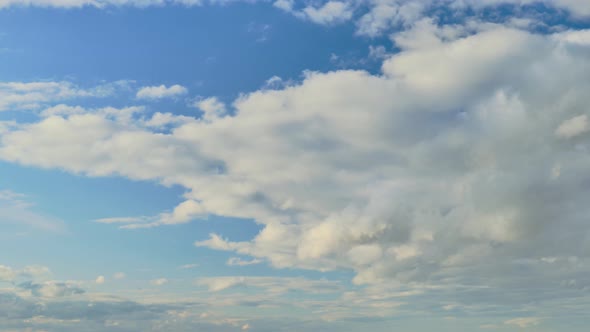 Cumulus clouds in the blue sky, autumn day timelapse