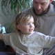 Happy Cheerful Caucasian Man Hugging His Small Cute Son and Laughing at Home - VideoHive Item for Sale
