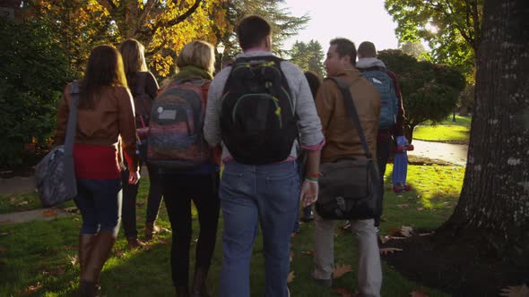 Group of college students walking on campus