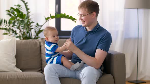 Happy Baby Boy with Father at Home  alt