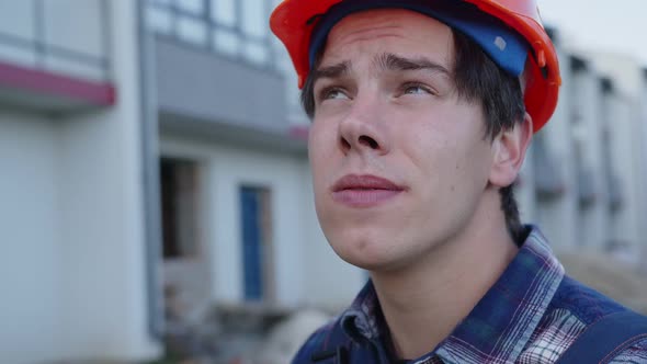 Close Up View of a Young Worker on Helmet
