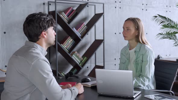 Human Resources Manager Conducting Job Interview with Applicant in Office alt