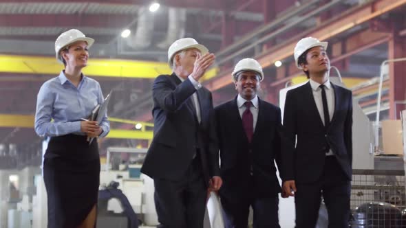 Team of Engineers Visiting Factory alt