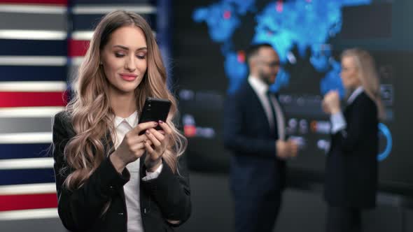 Happy Blonde Business Woman Communicating Online Application Use Smartphone Having Break at Work alt