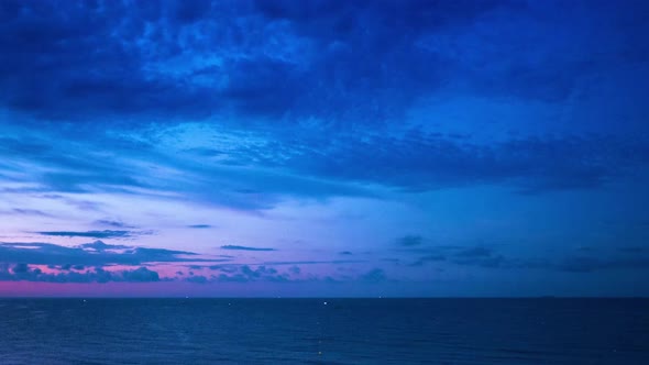 Timelapse shot of the sunrise over the sea in lloret de mar, spain. alt